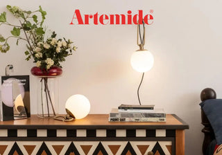 Illuminate your space with Artemide's iconic lighting designs. Discover the Tolomeo lamp, Mercury pendant, and Tizio table lamp. Buy now on SHOPDECOR®