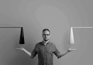 Brian Sironi: an innovator in home lighting and glass decor, famed for his Elica table lamp, Inbilico wall lamp, and Revolve vase. Buy now on SHOPDECOR®