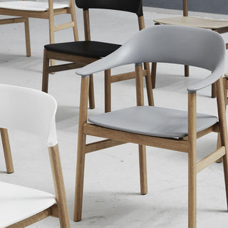 Normann Copenhagen Herit polypropylene armchair with oak legs - Buy now on ShopDecor - Discover the best products by NORMANN COPENHAGEN design